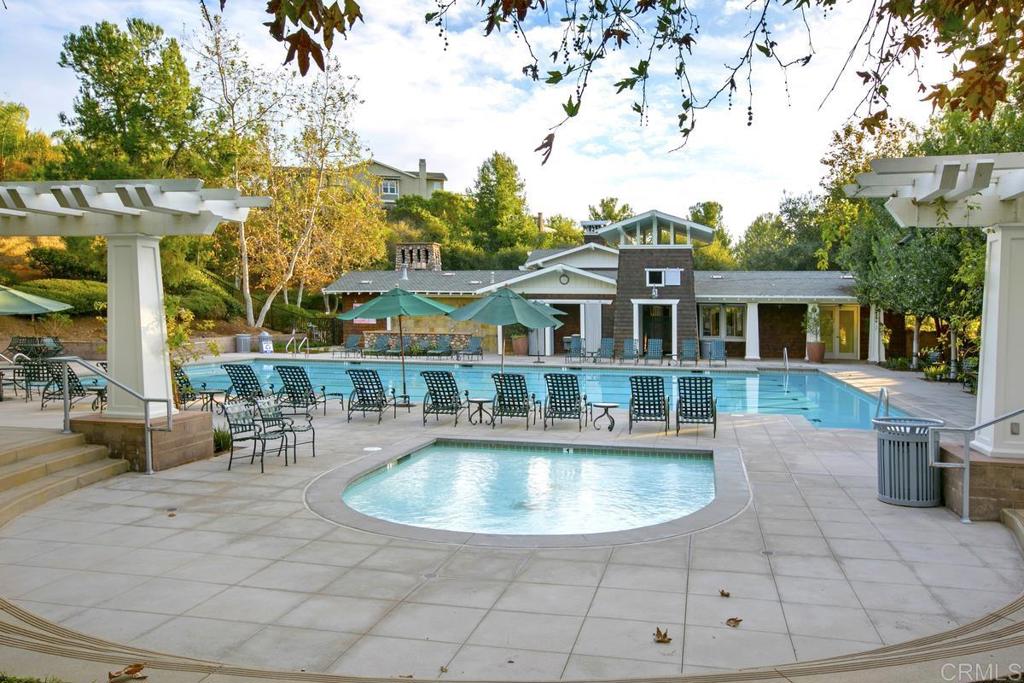 7603 Circulo Sequoia Carlsbad, CA 92009 - Photo 55 of 61 a view of a house with swimming pool and sitting area