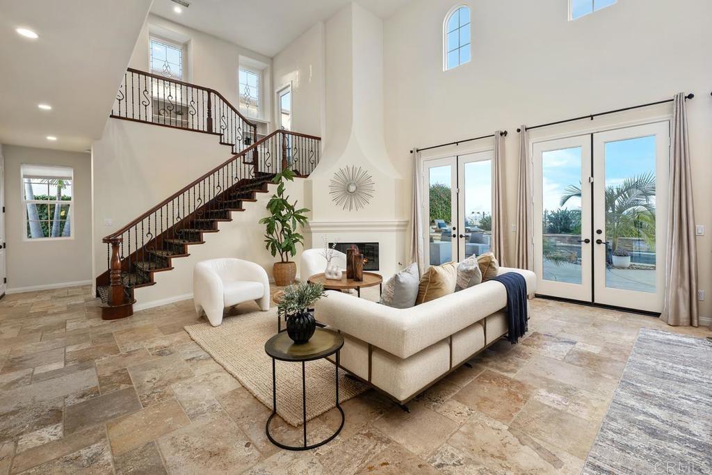 7603 Circulo Sequoia Carlsbad, CA 92009 - Photo 7 of 61 a living room with furniture chandelier and a view of living room