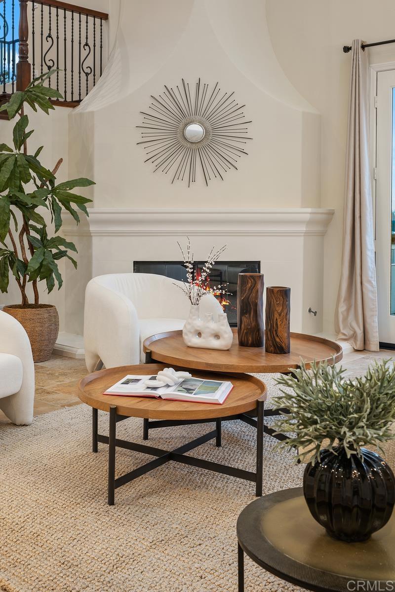 7603 Circulo Sequoia Carlsbad, CA 92009 - Photo 8 of 61 a living room with furniture and flowers