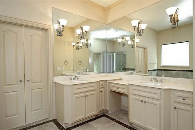 a bathroom with a sink double vanity and a mirror