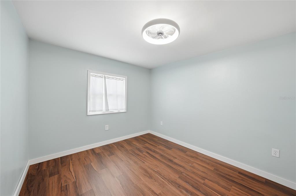8164 Archie Street Englewood, FL 34224 - Photo 12 of 42 a view of a room with wooden floor and windows