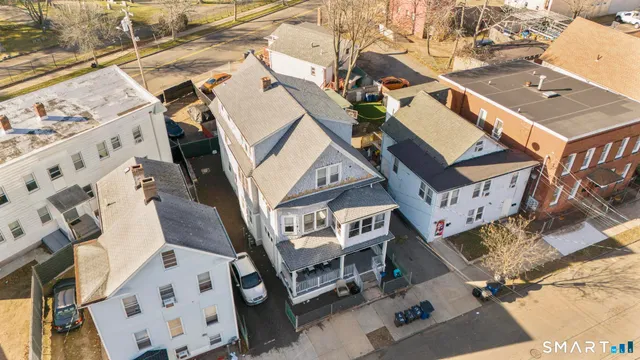 aerial view of a house with a street