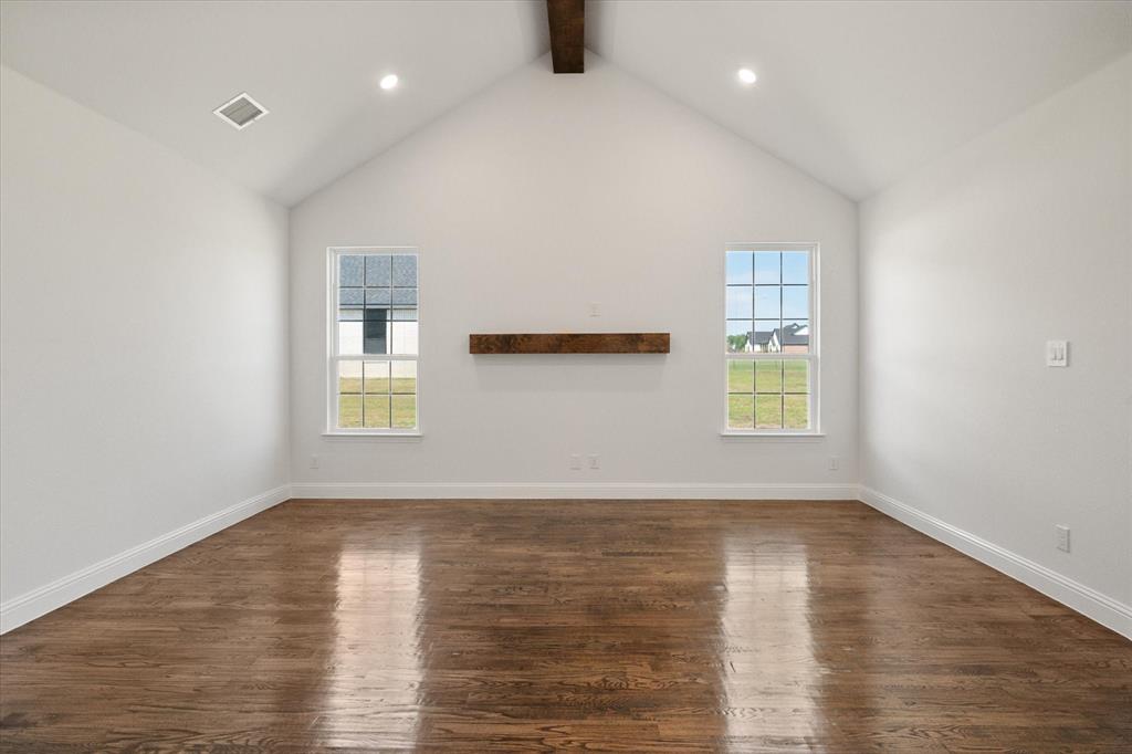3400 Dobbins Road Corsicana, TX 75110 - Photo 6 of 40 an empty room with wooden floor and windows