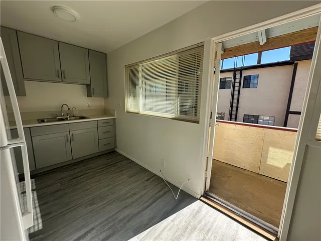 a kitchen with stainless steel appliances a sink and a refrigerator