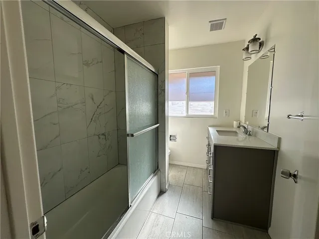 a bathroom with a sink and mirror