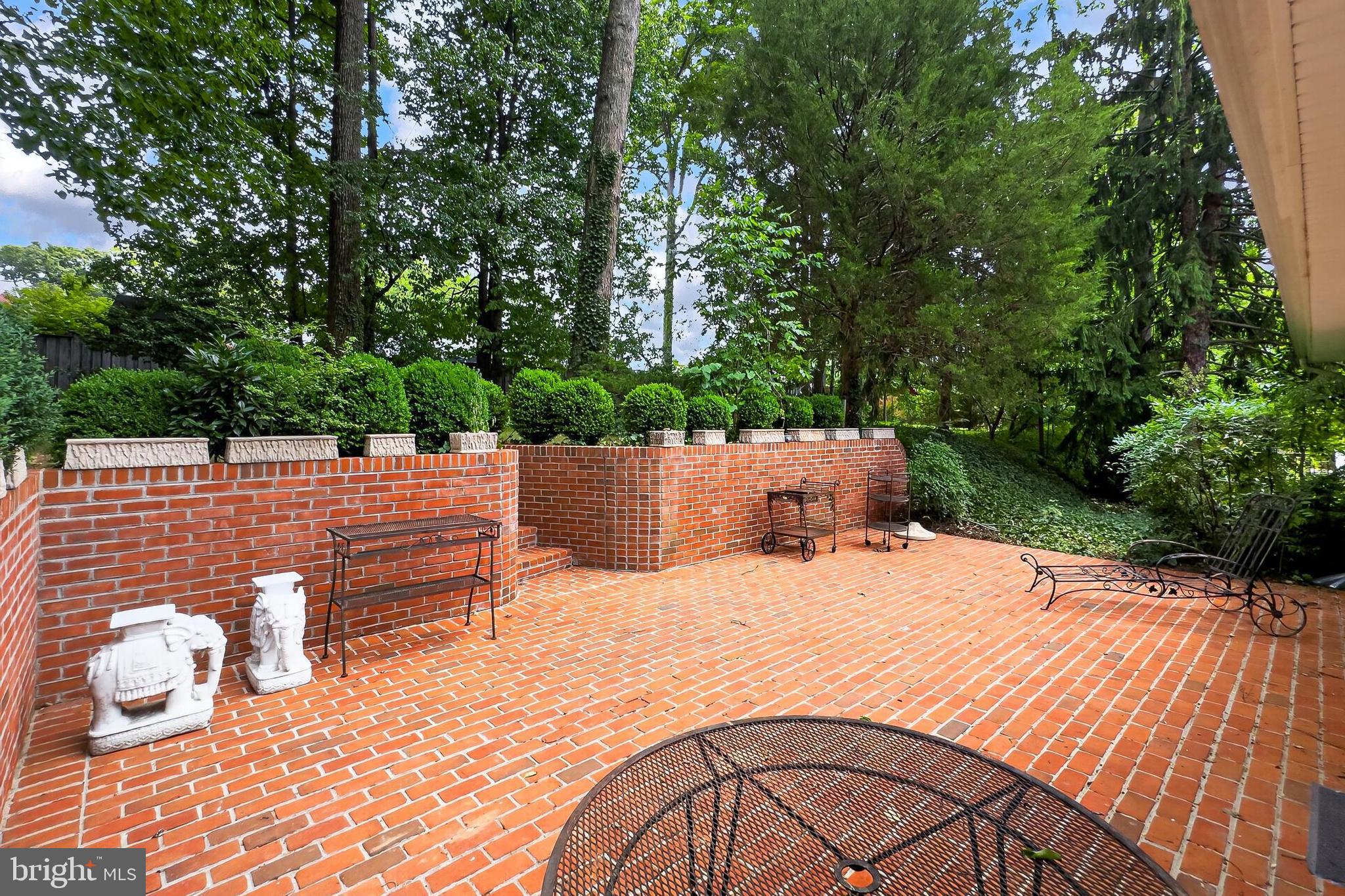 7604 Boulder Street Springfield, VA 22151 - Photo 15 of 39 a terrace view with sitting space and trees