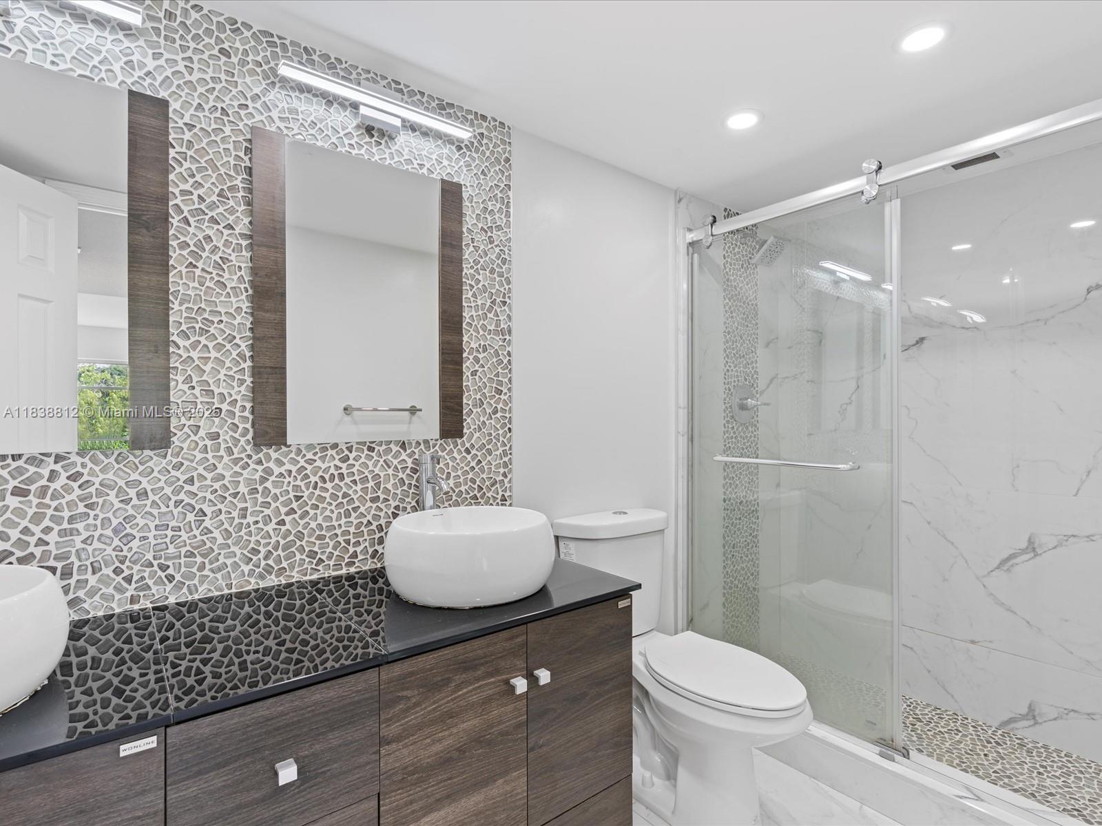 Palm Aire Pompano Beach, FL 33069 - Photo 19 of 26 a bathroom with a sink a toilet and shower