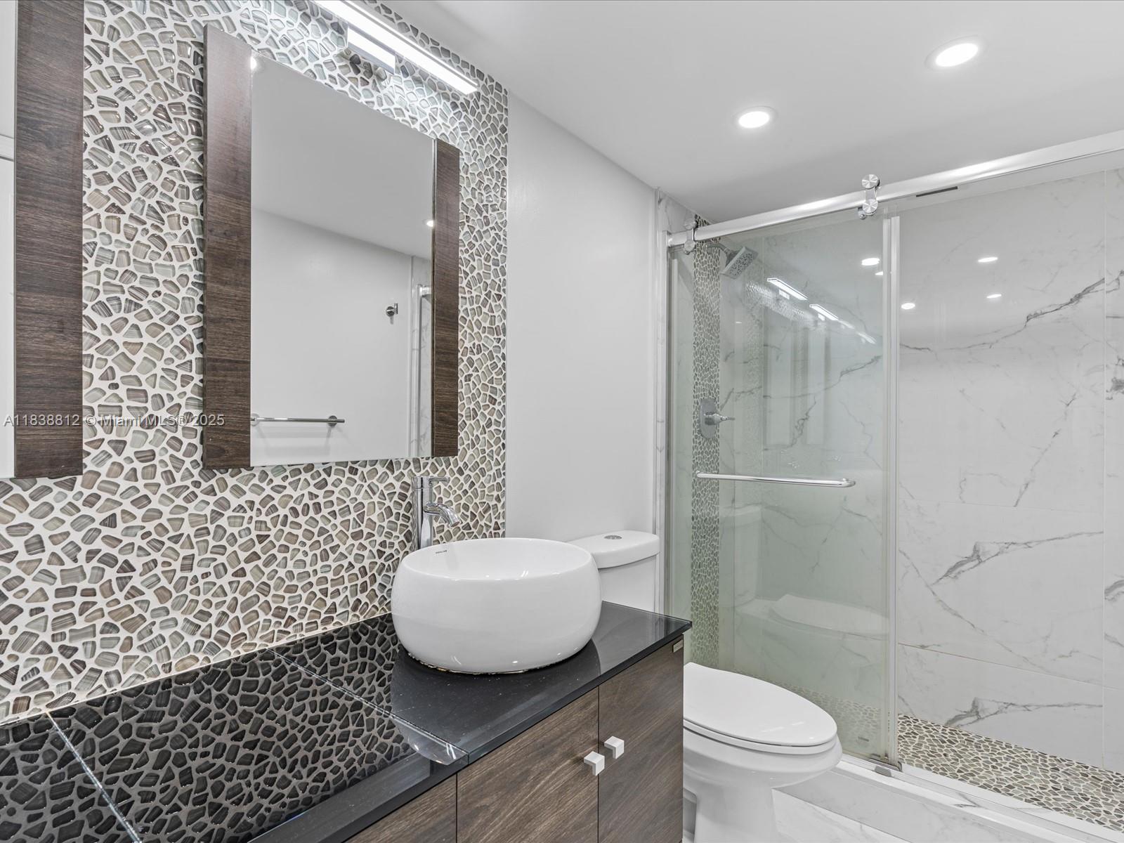 Palm Aire Pompano Beach, FL 33069 - Photo 20 of 26 a bathroom with a sink toilet and shower