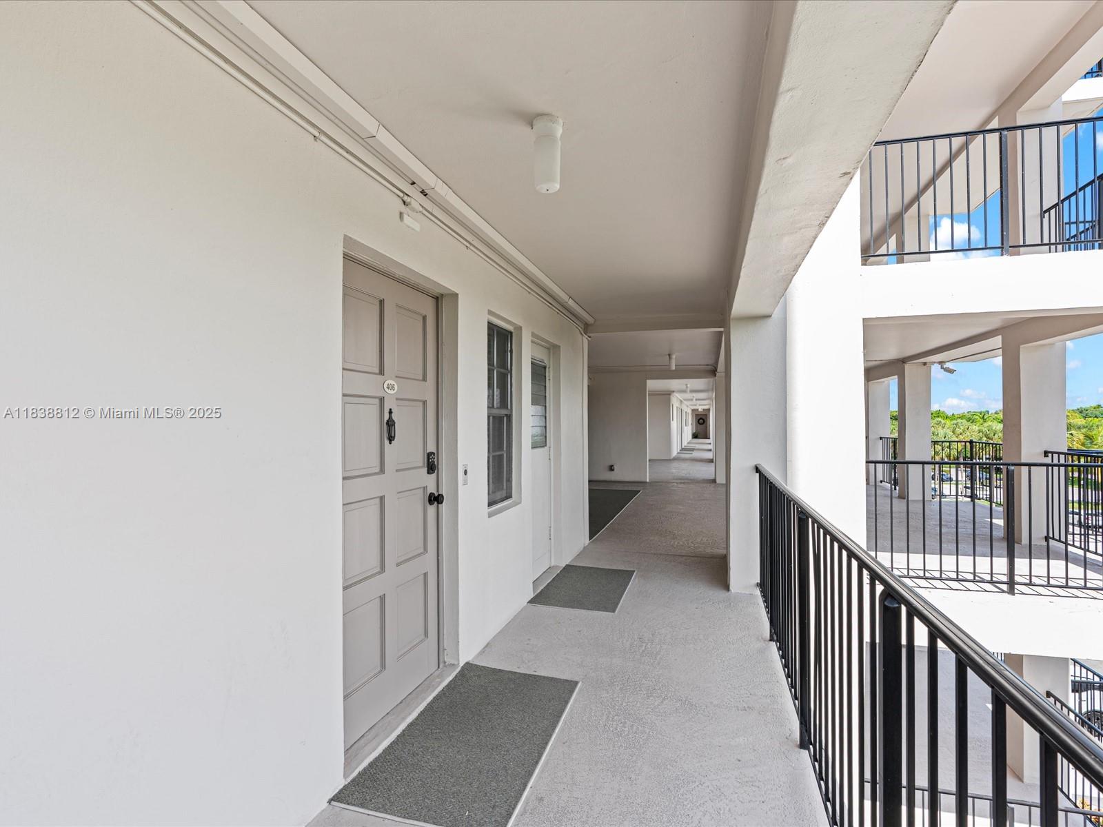 Palm Aire Pompano Beach, FL 33069 - Photo 24 of 26 a view of a hallway with wooden floor and staircase