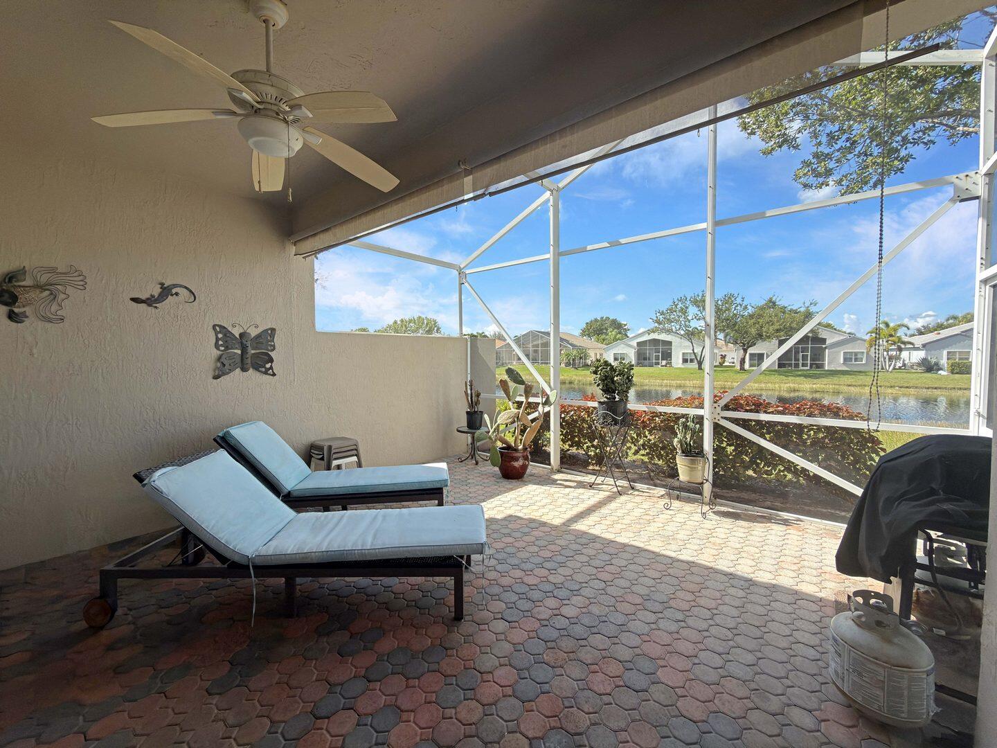 8214 Bellafiore Way Boynton Beach, FL 33472 - Photo 20 of 35 a living room with patio furniture