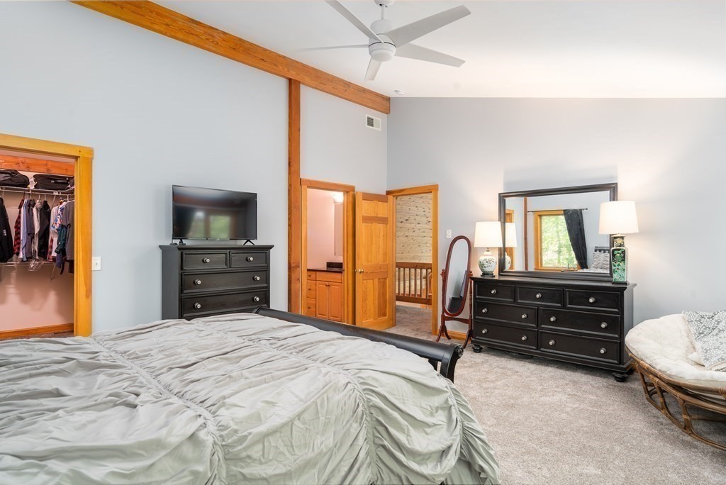 56 Southampton Road Westhampton, MA 01027 - Photo 24 of 42 a bedroom with a bed and a dresser
