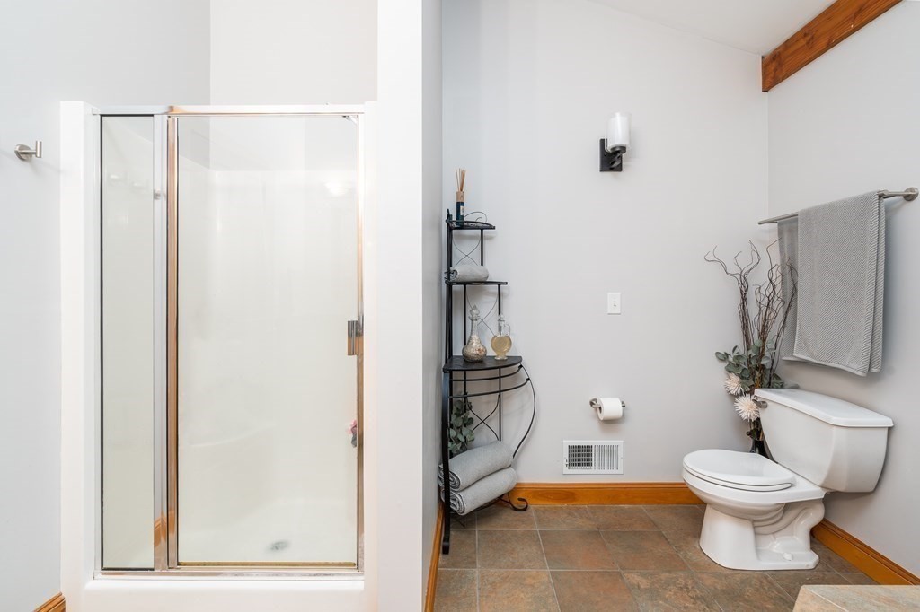 56 Southampton Road Westhampton, MA 01027 - Photo 27 of 42 a bathroom with a toilet and a shower