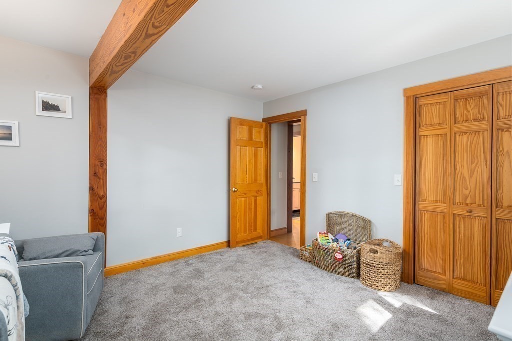 56 Southampton Road Westhampton, MA 01027 - Photo 32 of 42 a bedroom with a bed and a window