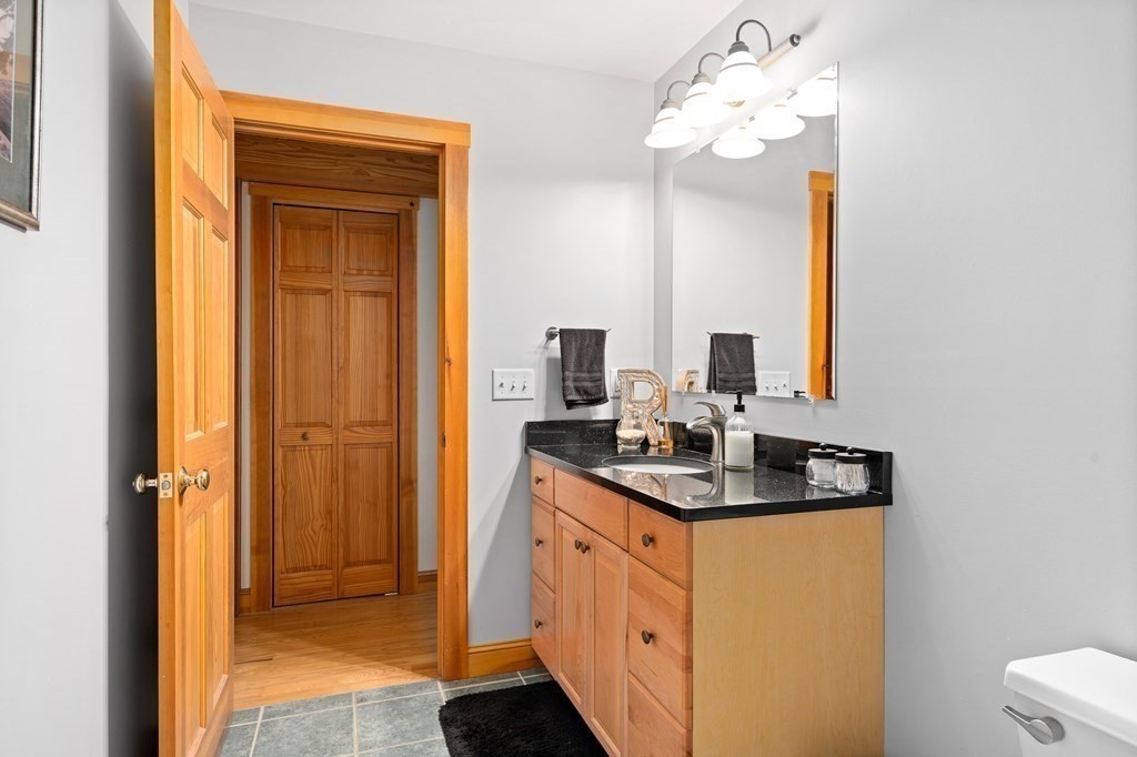 56 Southampton Road Westhampton, MA 01027 - Photo 34 of 42 a bathroom with a sink a mirror and a shower