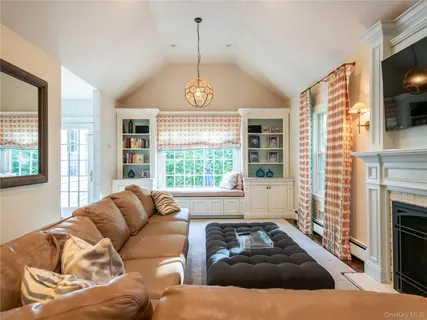 a living room with furniture and a fireplace