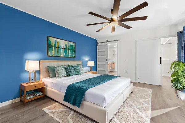 a bedroom with a bed and a table