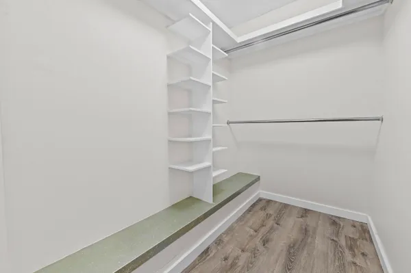 a view of an empty walk in closet