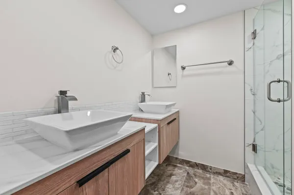 a bathroom with a sink and a mirror