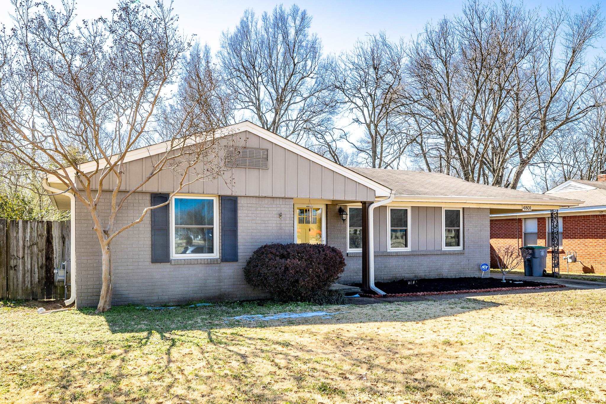 4801 Sea Isle Road Memphis, TN 38117 - Photo 1 of 18 a front view of a house with a yard covered in snow