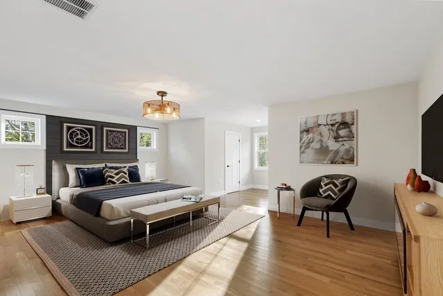 a bedroom with a bed and a couch