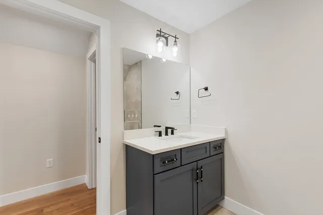 a bathroom with a sink and a mirror