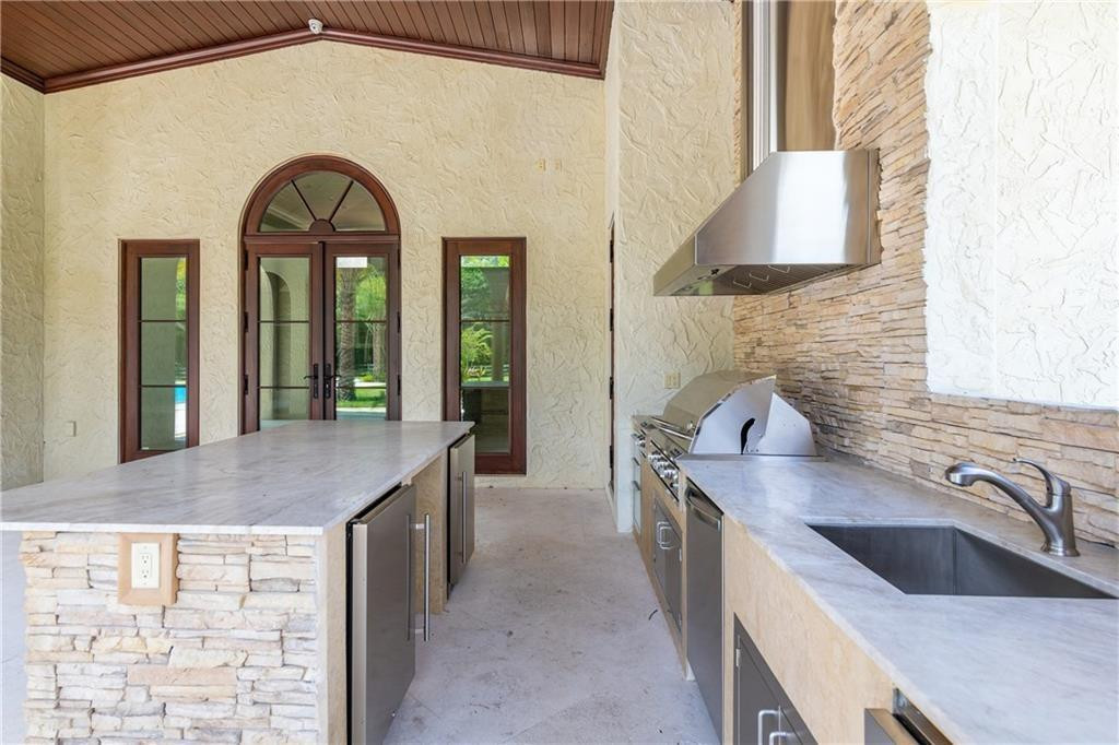 5850 Hancock Road Southwest Ranches, FL 33330 - Photo 63 of 76 SUMMER KITCHEN WITH ISLAND