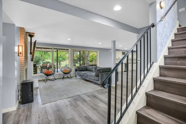 a kitchen with a refrigerator and a stove top oven
