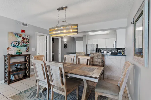 a kitchen with stainless steel appliances granite countertop a sink refrigerator and microwave