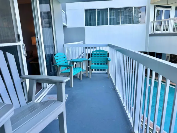 a view of a swimming pool with a patio