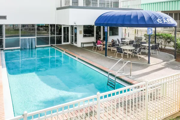 a view of a swimming pool with a lounge chairs