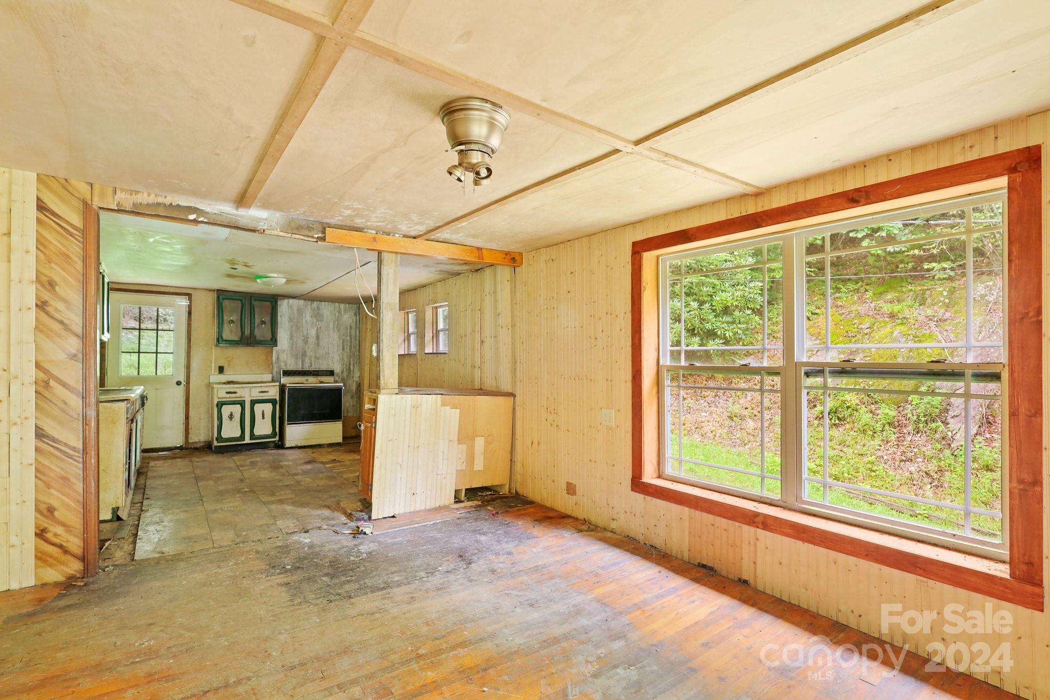 809 Long Branch Road Lansing, NC 28643 - Photo 4 of 18 a view of a livingroom with furniture and a window