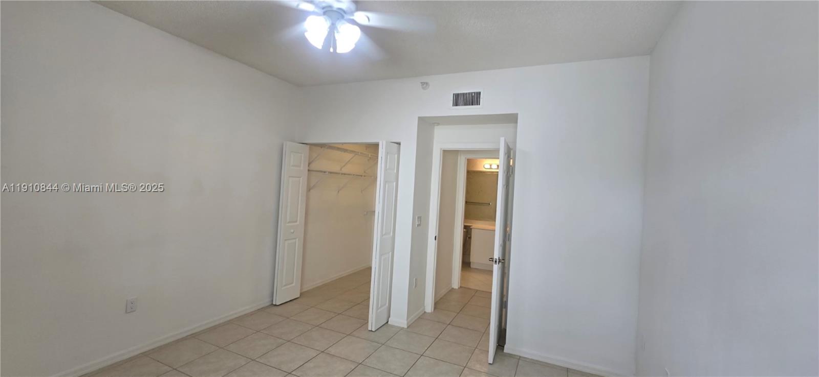 7775 Southampton Terrace, Unit 305 Tamarac, FL 33321 - Photo 13 of 39 an empty room with closet area