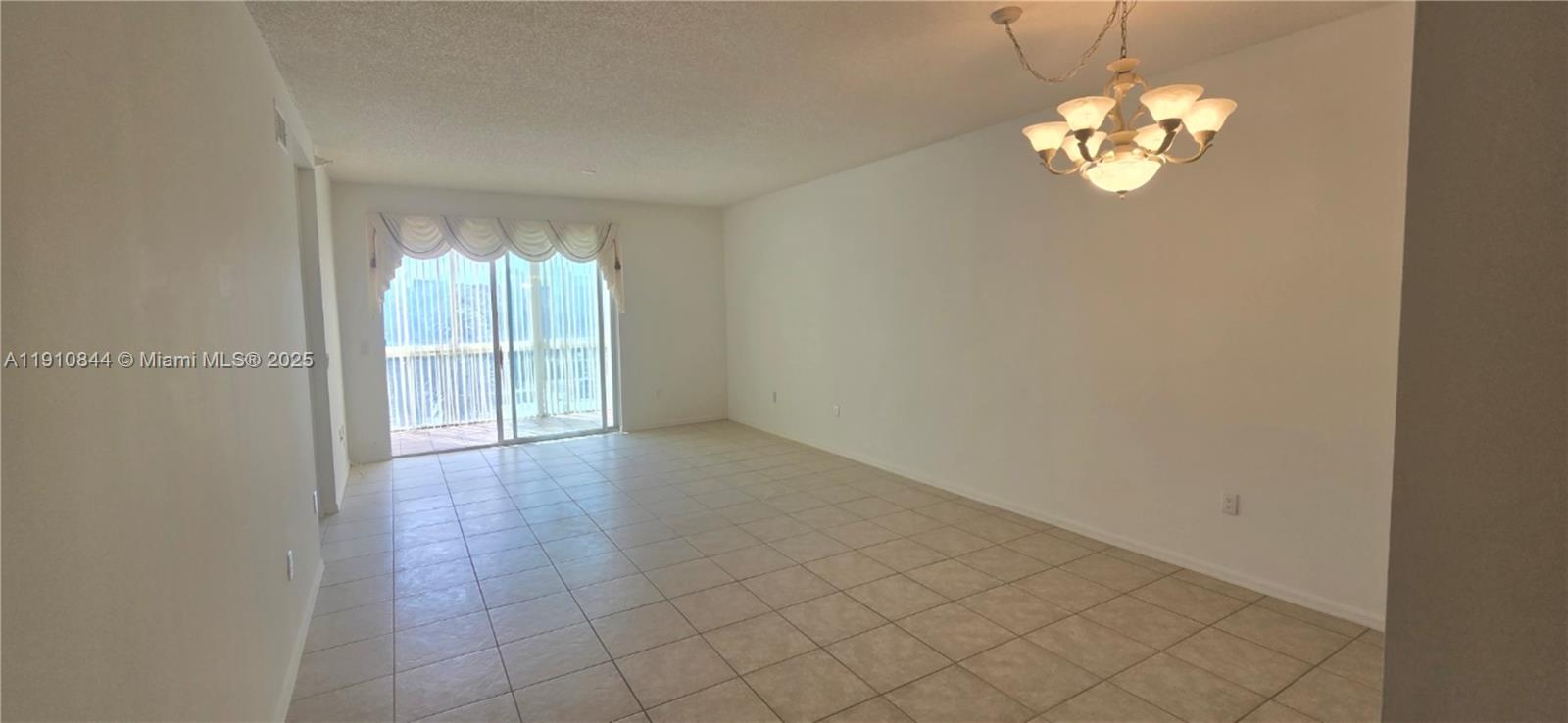 7775 Southampton Terrace, Unit 305 Tamarac, FL 33321 - Photo 14 of 39 wooden floor in an empty room with a window