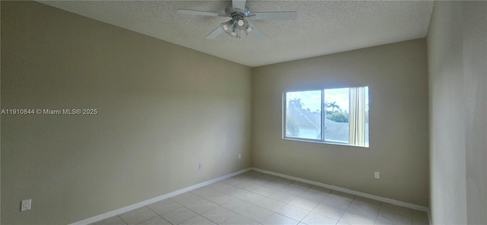 7775 Southampton Terrace, Unit 305 Tamarac, FL 33321 - Photo 21 of 39 an empty room with windows