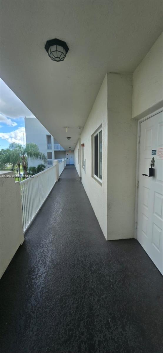 7775 Southampton Terrace, Unit 305 Tamarac, FL 33321 - Photo 31 of 39 a view of a hallway with entryway