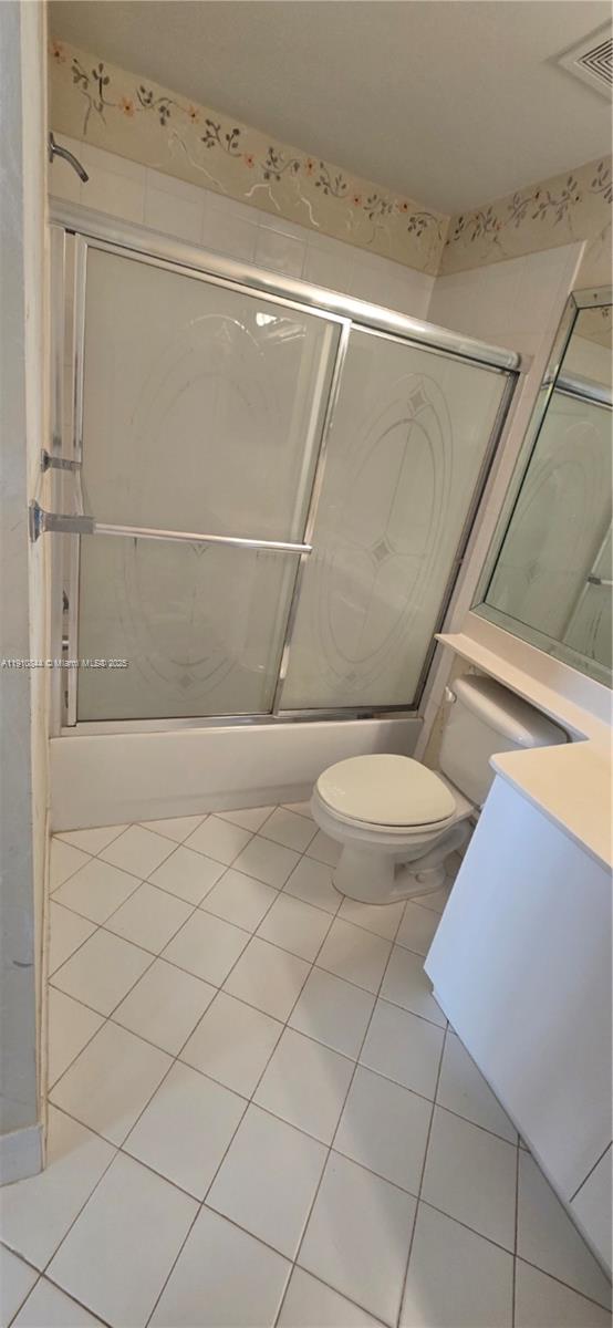 7775 Southampton Terrace, Unit 305 Tamarac, FL 33321 - Photo 10 of 39 a bathroom with a toilet and a shower