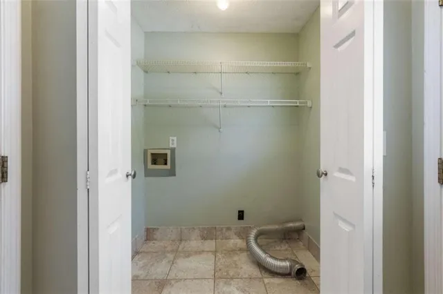 a spacious bedroom with a bed and a window