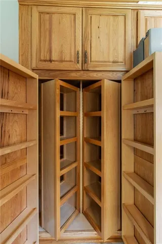 a living room with furniture a flat screen tv and a large window