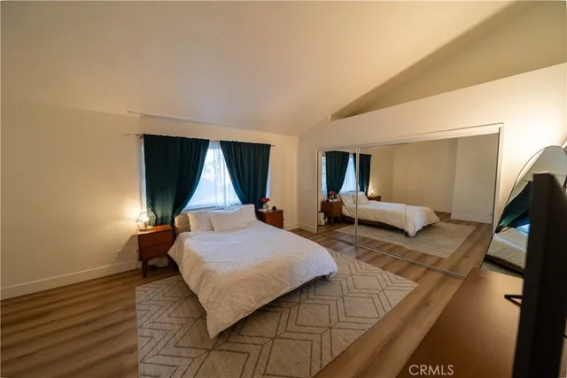 a bedroom with a bed and window