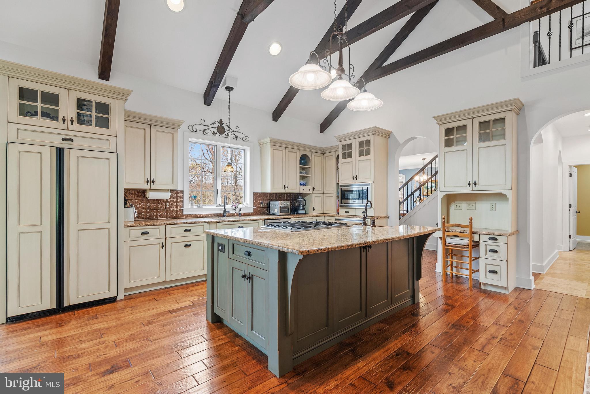 97 Wilson Road Christiana, PA 17509 - Photo 11 of 58 a kitchen with stainless steel appliances granite countertop a lot of counter space and wooden floors