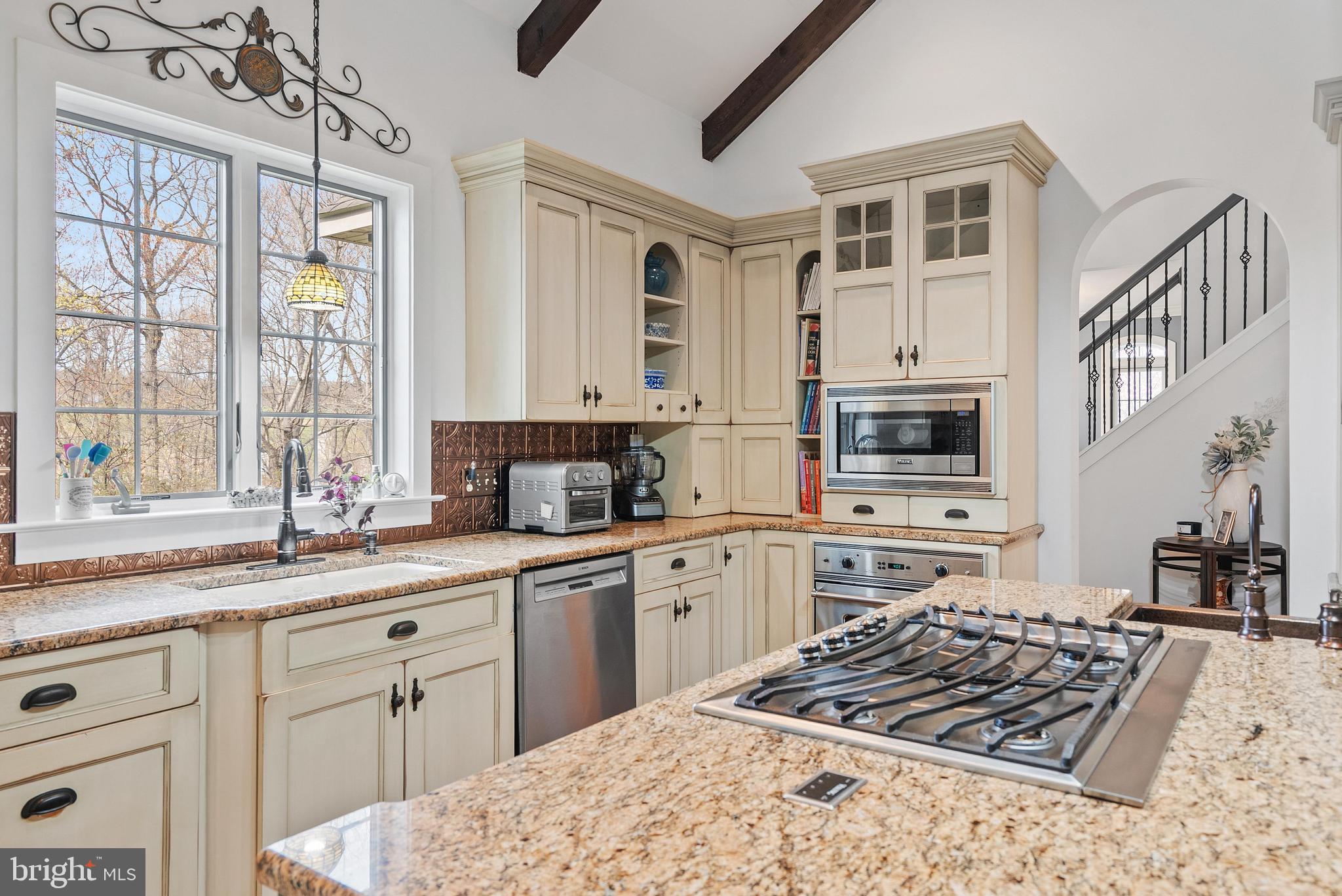 97 Wilson Road Christiana, PA 17509 - Photo 13 of 58 a kitchen with stainless steel appliances granite countertop a stove sink and cabinets