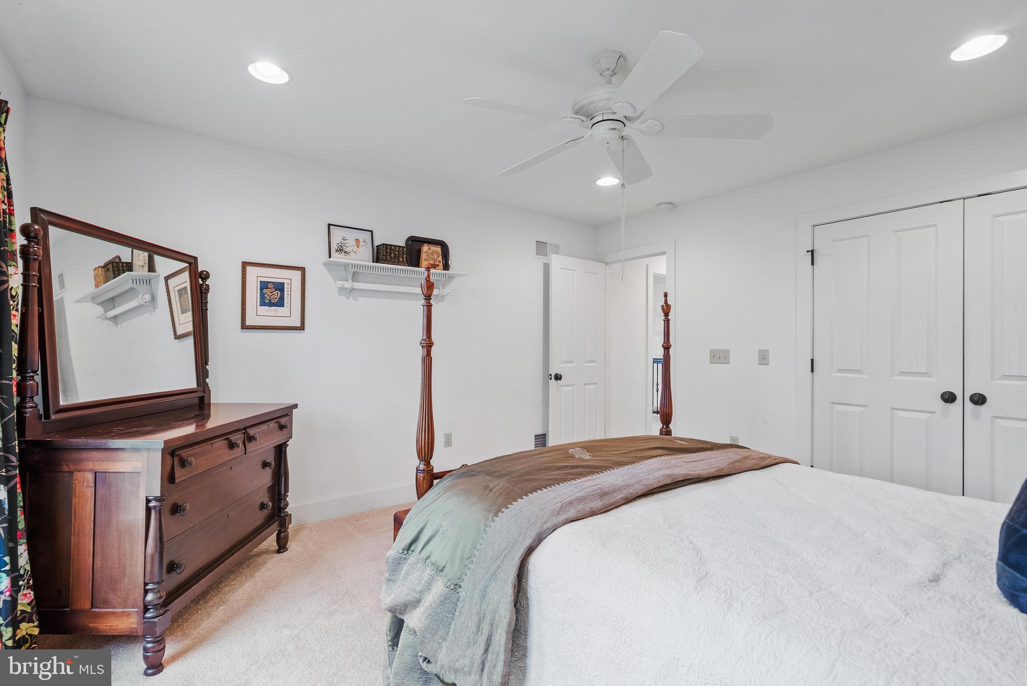 97 Wilson Road Christiana, PA 17509 - Photo 36 of 58 a spacious bedroom with a bed and a flat screen tv