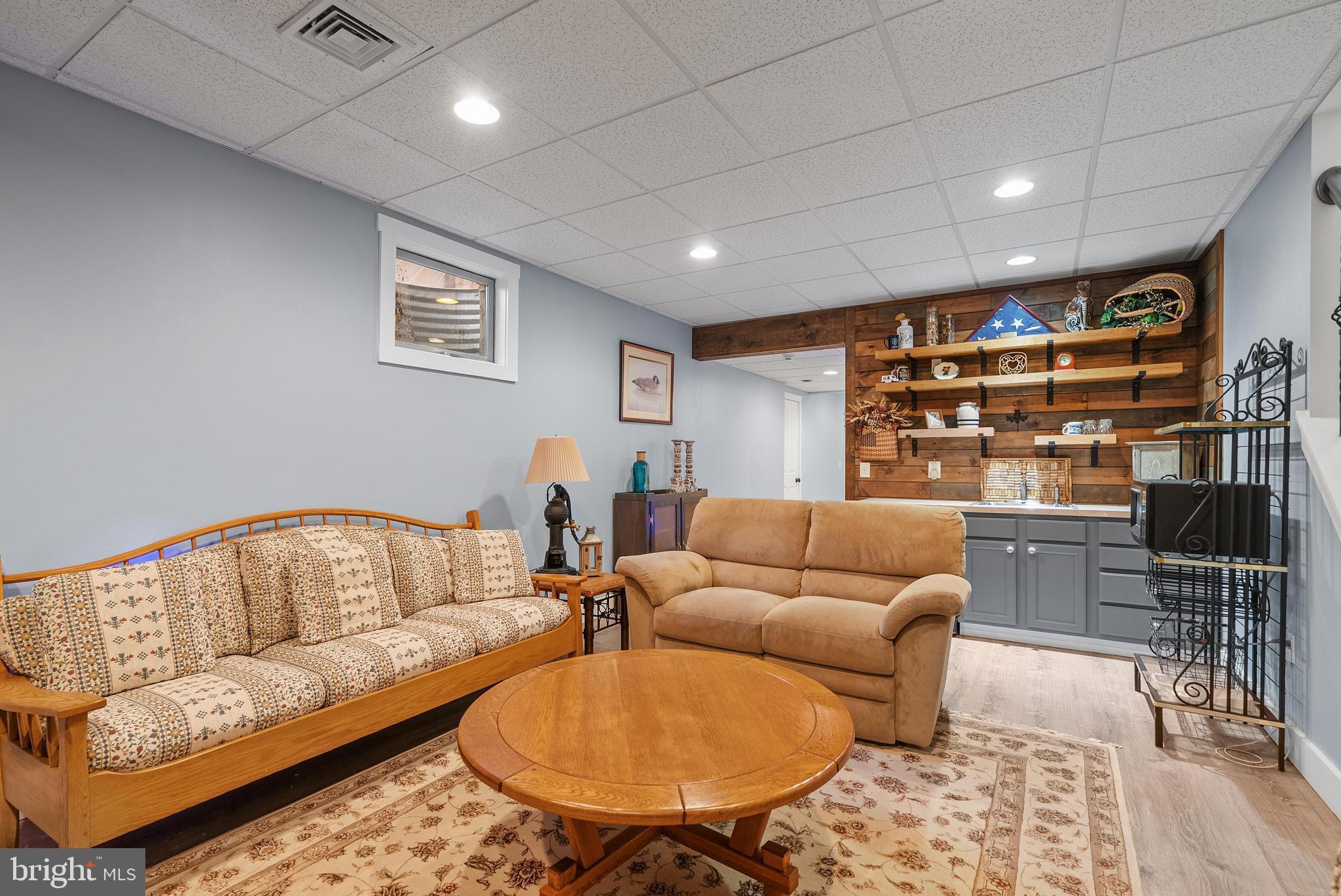 97 Wilson Road Christiana, PA 17509 - Photo 41 of 58 a living room with furniture a ceiling fan and a rug