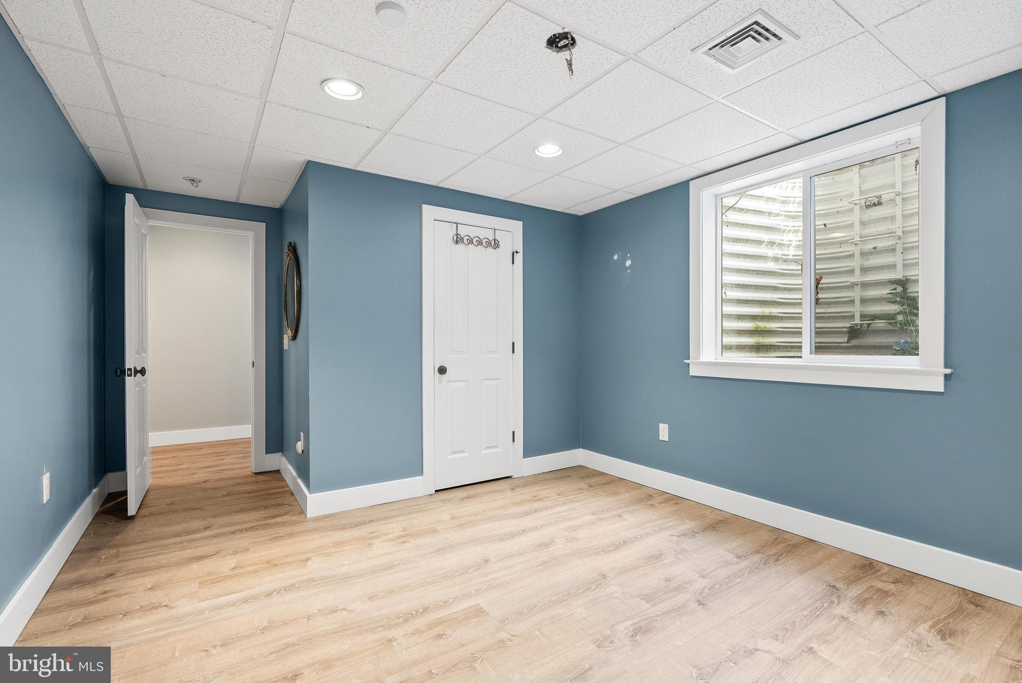 97 Wilson Road Christiana, PA 17509 - Photo 46 of 58 a view of an empty room with wooden floor and a window