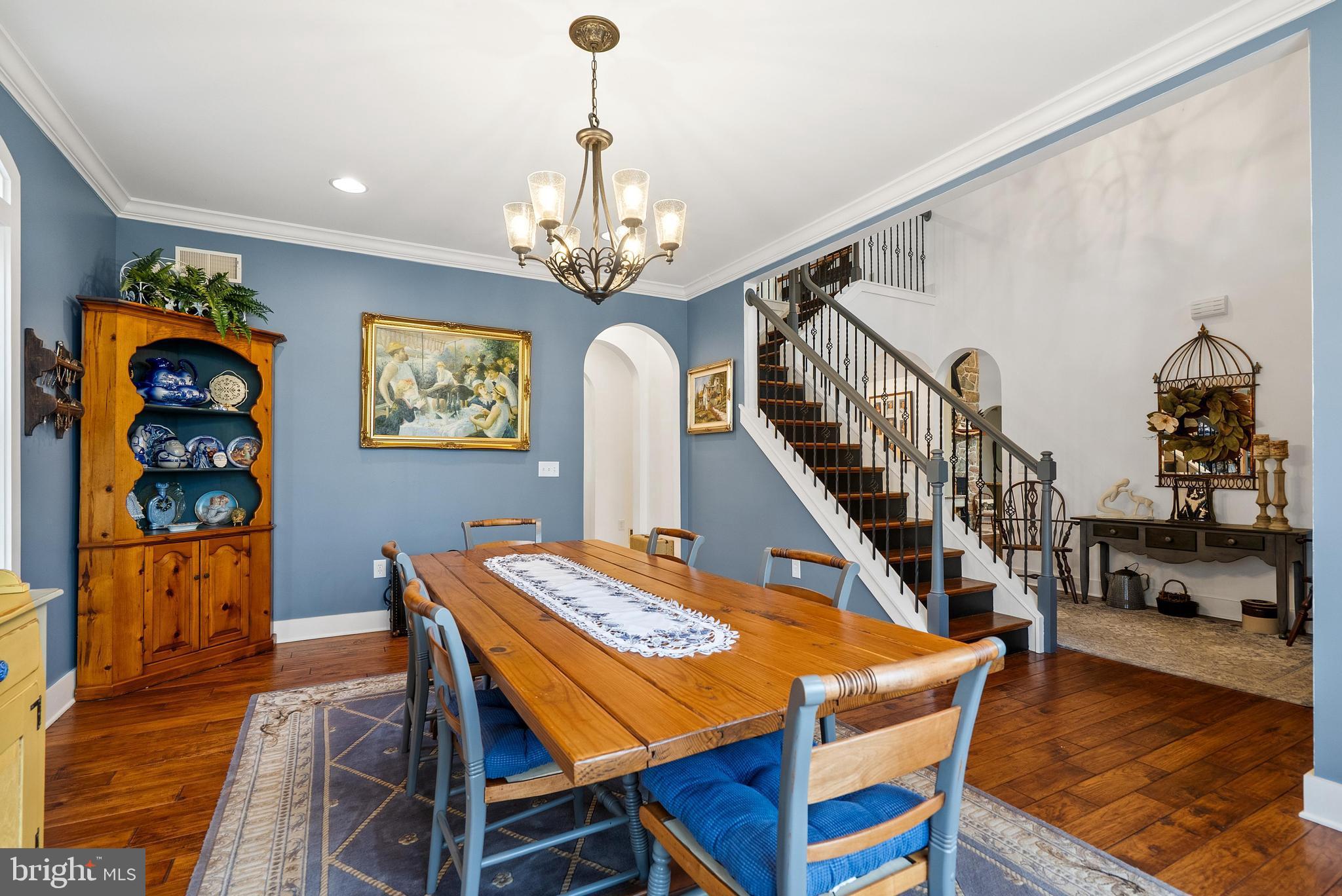 97 Wilson Road Christiana, PA 17509 - Photo 5 of 58 a dining room with wooden floor a chandelier a wooden table and chairs