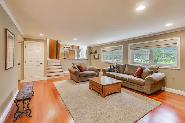 a view of a workspace with furniture and a kitchen