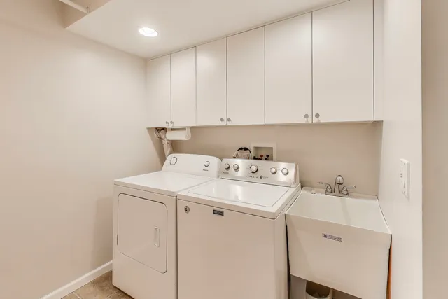 a spacious bedroom with a large bed and a window