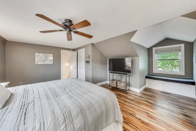 a bedroom with a bed and a lamp