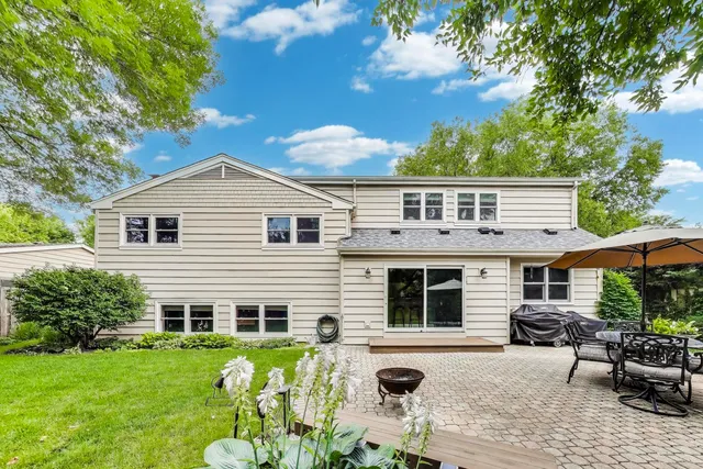 a view of a backyard with furniture and a small yard