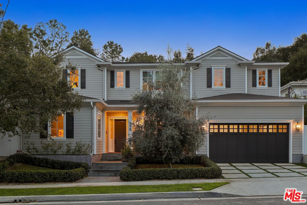 955 Bienveneda Avenue Pacific Palisades, CA 90272 - Photo 1 of 1 a view of a white house next to a yard